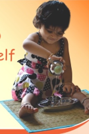 Toddler exploring practical life activities